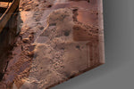 Lake artwork anchoring a hallway with dramatic palette
