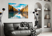 Lake glass wall art styled above a sofa in a cabin-mood living room