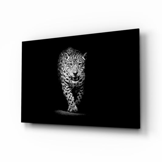 Leopard glass wall art displayed above a console in a designer interior