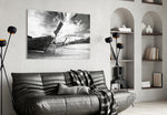 Boats on the Beach glass wall art styled above a sofa in a global-adventure living room
