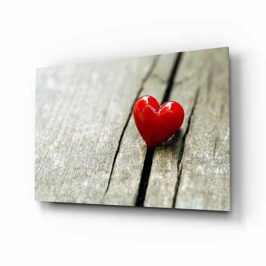 Heart glass wall art displayed above a console in a designer interior