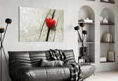 Heart glass wall art styled above a bed in a gentle-mood bedroom