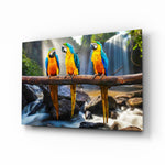 Parrots glass wall art displayed above a console in a designer interior