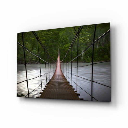 Suspension Bridge glass wall art displayed above a console in a designer interior