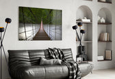 Suspension Bridge glass wall art styled above a sofa in a forest-mood living room
