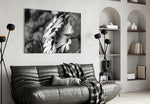 Black-White Flower glass wall art styled above a bed in a graphic-mood bedroom