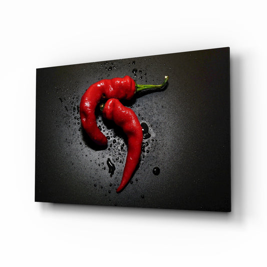 Red Pepper glass wall art displayed above a console in a designer interior