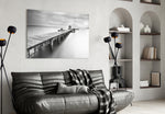 Dock glass wall art styled above a sofa in a contemplative living room