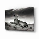 Lioness glass wall art displayed above a console in a designer interior