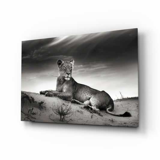 Lioness glass wall art displayed above a console in a designer interior