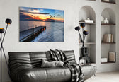 Dock glass wall art styled above a sofa in a statement-color living room