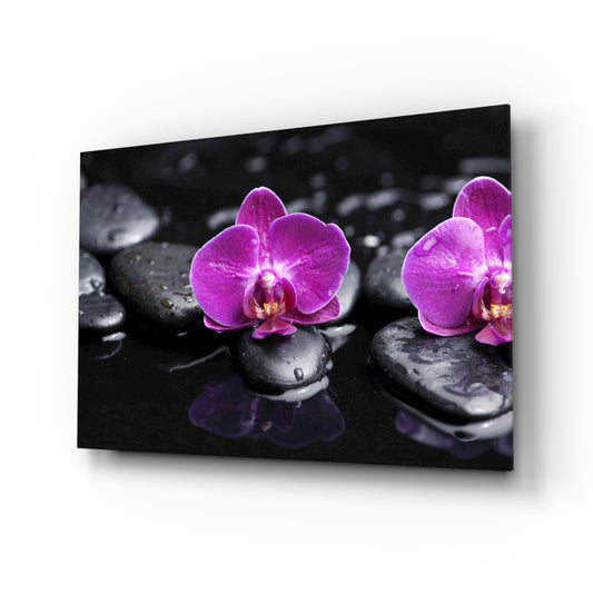 Orchid glass wall art displayed above a console in a designer interior