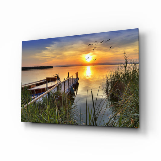 Sunset glass wall art displayed above a console in a designer interior