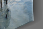 Sunset artwork anchoring a hallway with cool coastal palette