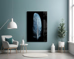 Blue Feather glass wall art styled above a bed in a cool-palette bedroom