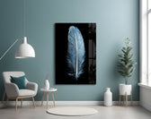 Blue Feather glass wall art styled above a bed in a cool-palette bedroom