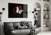 Butterfly glass wall art styled above a bed in a statement-mood bedroom