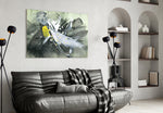 Abstract glass wall art styled above a sofa in a contemporary lounge