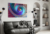 Abstract glass wall art styled above a sofa in a peacock-taste lounge
