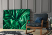 Green Tropical Leaf glass print enhancing a kitchen nook with fresh greenery