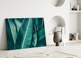 Close-up detail of the teal leaf ridges in cool light