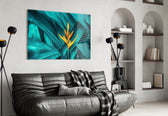 Tropical Leaf 3 glass wall art styled above a sofa in a statement-color living room