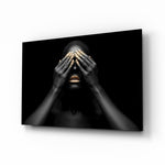 Woman glass wall art displayed above a console in a designer interior