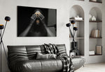 Woman glass wall art styled above a bed in a black-and-gold bedroom