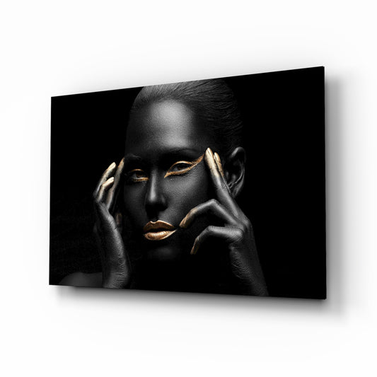Woman glass wall art displayed above a console in a designer interior