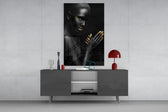 Woman artwork anchoring a lounge with metallic accents