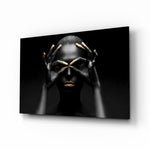 Woman glass wall art displayed above a console in a designer interior