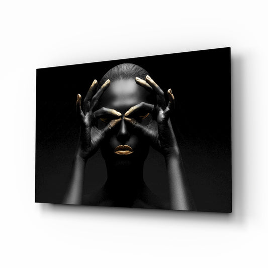 Woman glass wall art displayed above a console in a designer interior