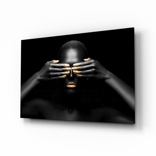 Woman glass wall art displayed above a console in a designer interior