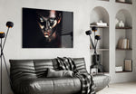 Woman glass wall art styled above a bed in an editorial bedroom