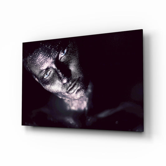 Woman glass wall art displayed above a console in a designer interior