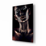 Woman glass wall art displayed above a console in a designer interior