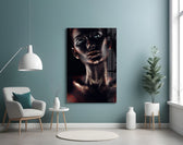 Woman glass wall art styled above a bed in a moody bedroom