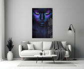 Woman glass wall art styled above a bed in a moody-color bedroom