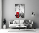 Close-up detail of the red phone box against black-and-white Big Ben