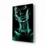 Woman glass wall art displayed above a console in a designer interior