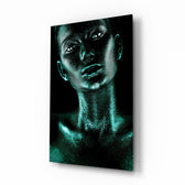 Woman glass wall art displayed above a console in a designer interior