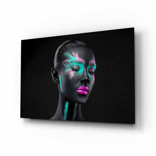 Woman glass wall art displayed above a console in a designer interior