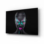 Woman glass wall art displayed above a console in a designer interior