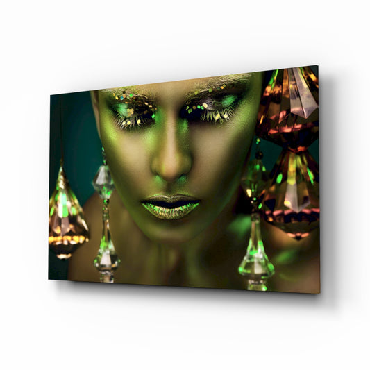 Woman glass wall art displayed above a console in a designer interior