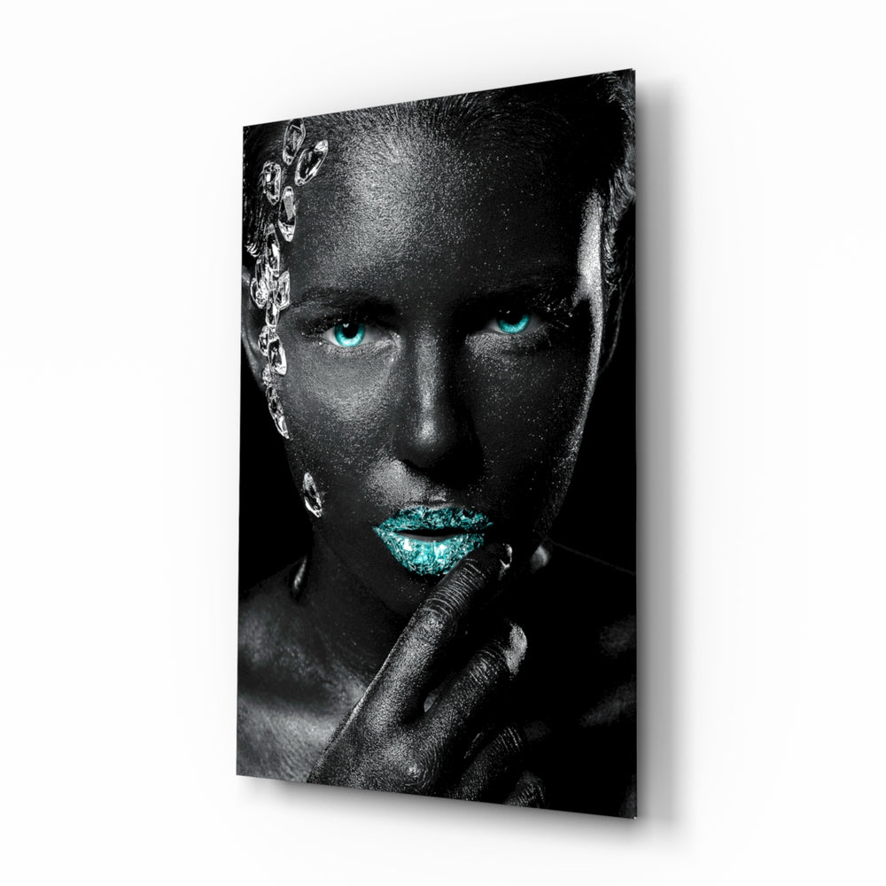 Woman glass wall art displayed above a console in a designer interior