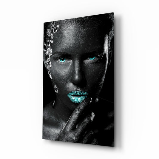 Woman glass wall art displayed above a console in a designer interior
