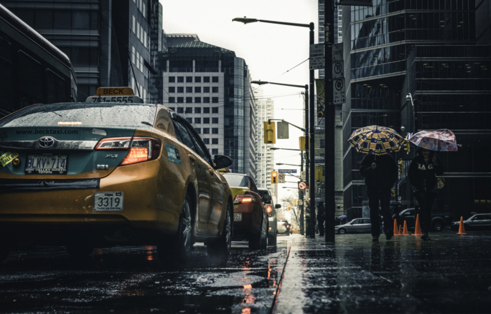 Rain in the City Glass Wall Art