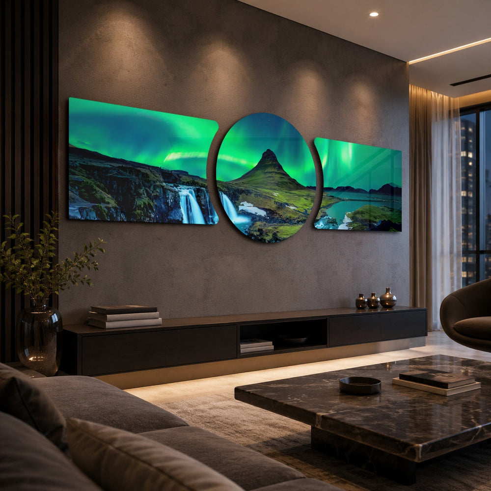 Green northern lights swirling over a peaked mountain, waterfall and calm fjord at night. 3 piece glass wall art set B