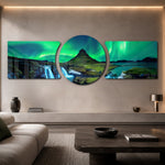 Green northern lights swirling over a peaked mountain, waterfall and calm fjord at night. 3 piece glass wall art set C