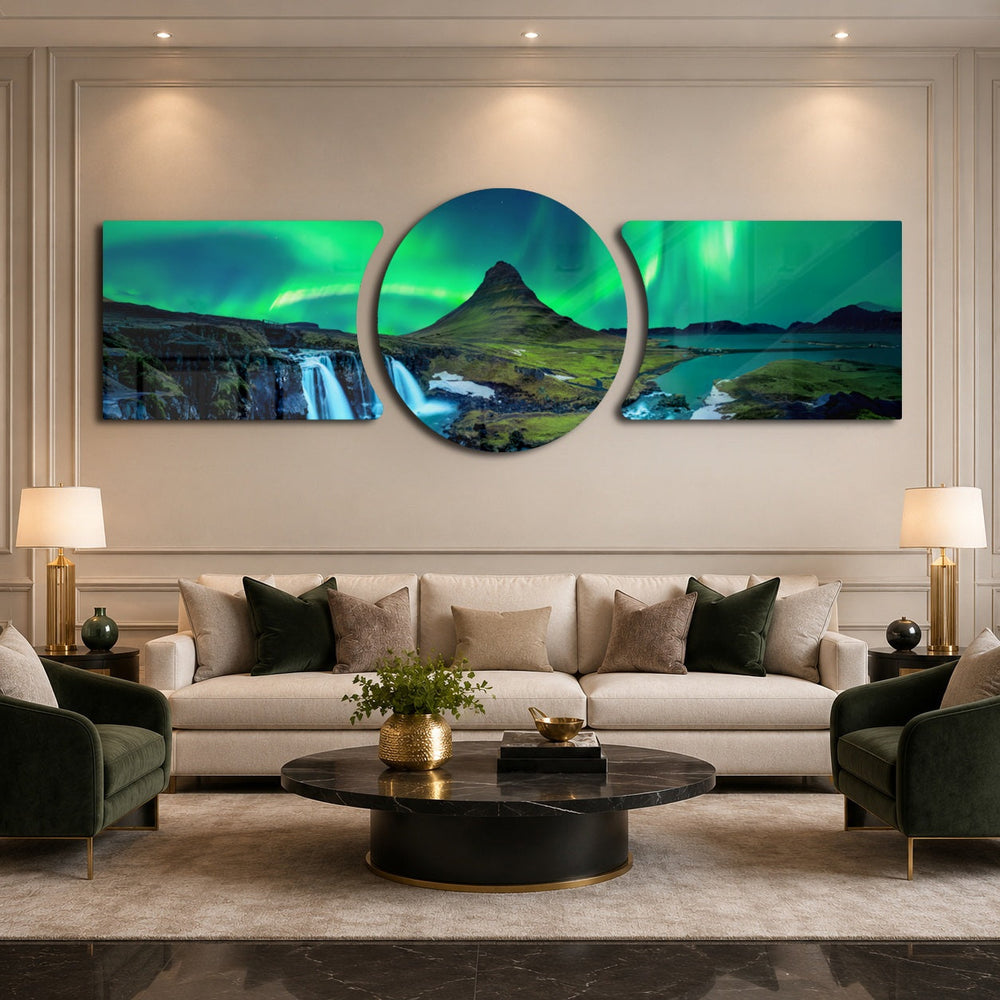 Green northern lights swirling over a peaked mountain, waterfall and calm fjord at night. 3 piece glass wall art set D
